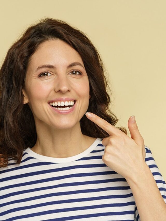 cropped-woman-with-beaming-smile-point-to-white-healthy-te-2021-09-03-00-31-47-utc.jpg